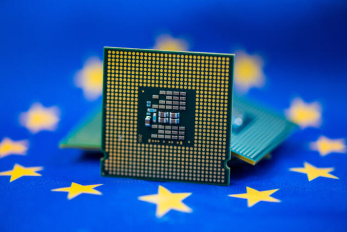 A microchip in front of the European flag